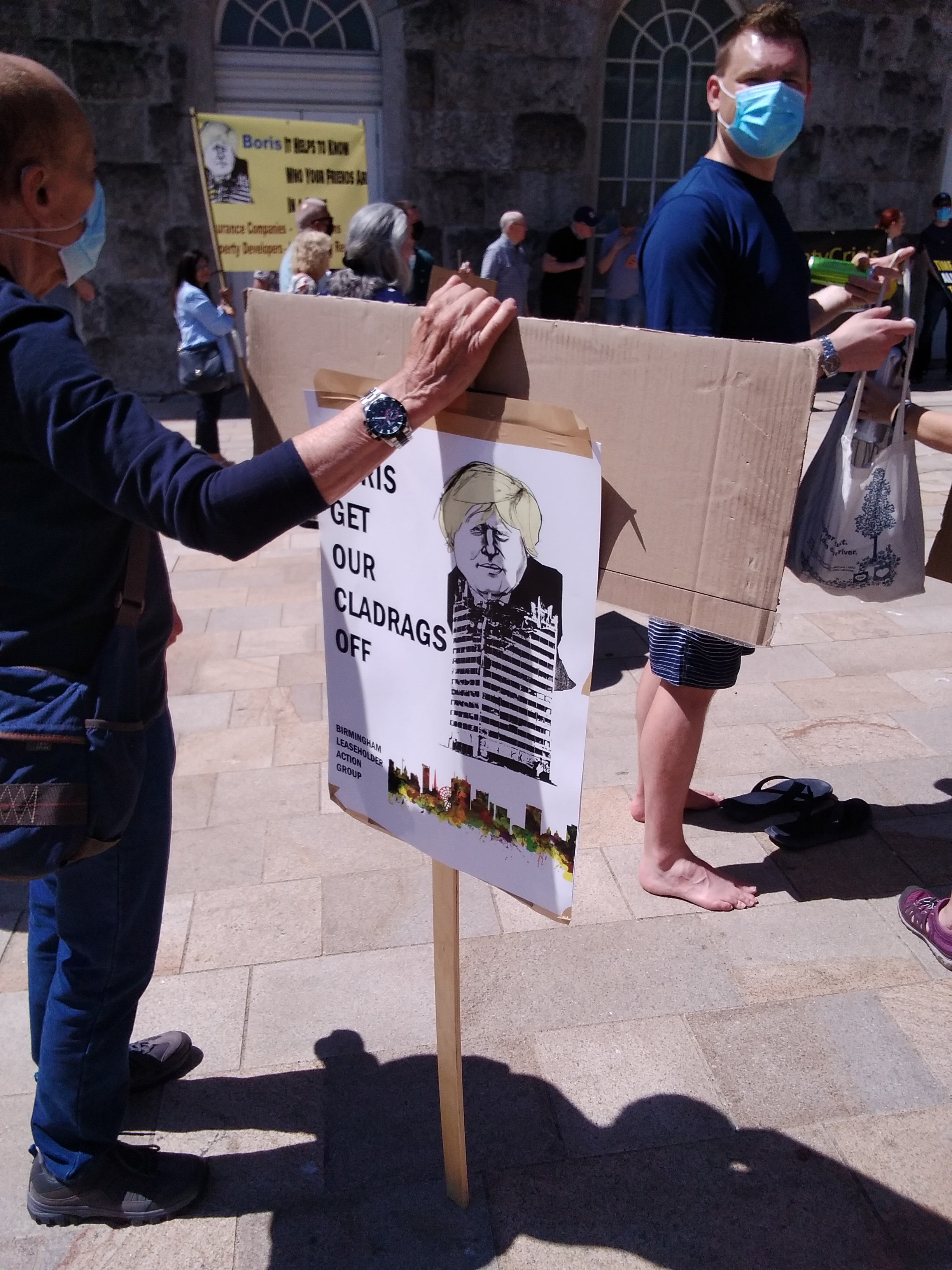 Sign reading Boris Get our Cladrags off with a caricature of Boris Johnson