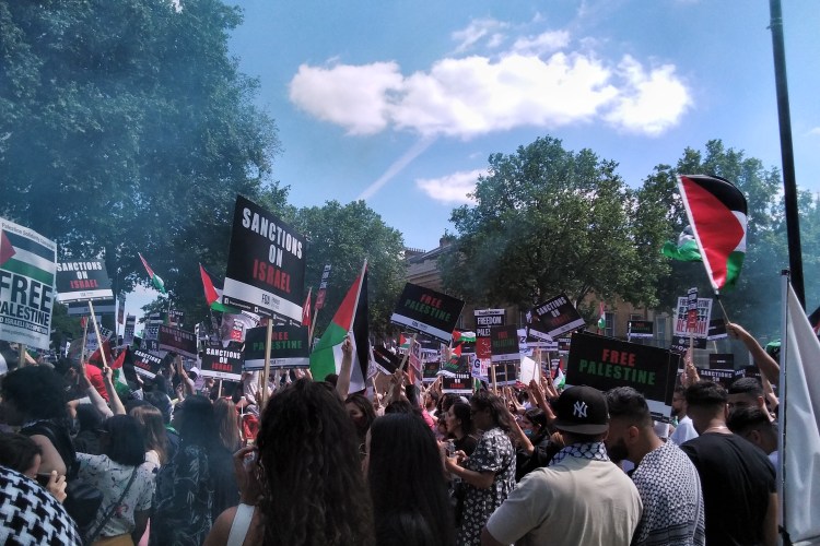 Free Palestine crowd in London, signs 'Sanctions on Israel' 'Free Palestine'