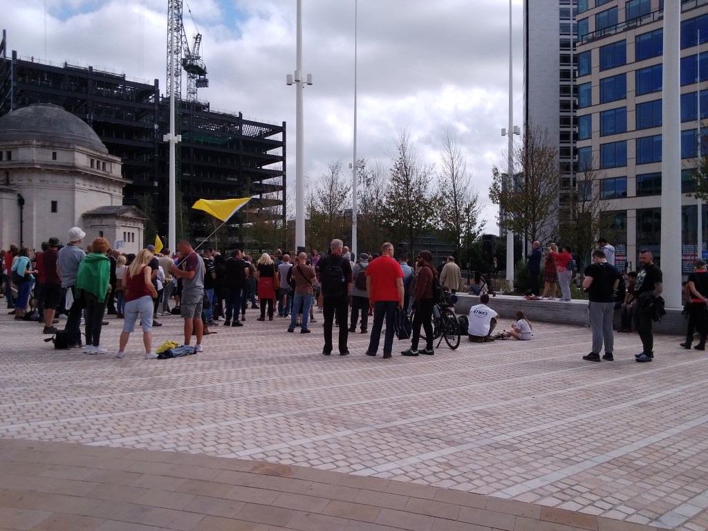 Protesters in Chamberlain Square, Birmingham. War Memorial is in the background.